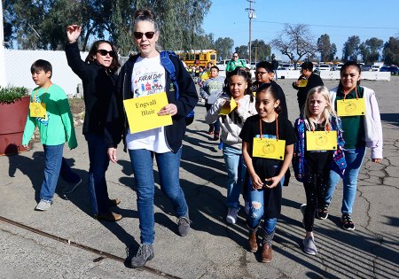 Mrs. Blair of P.W. Engvall leads her third grade class into the Kings Fairgrounds to start their Farm Day field trip.